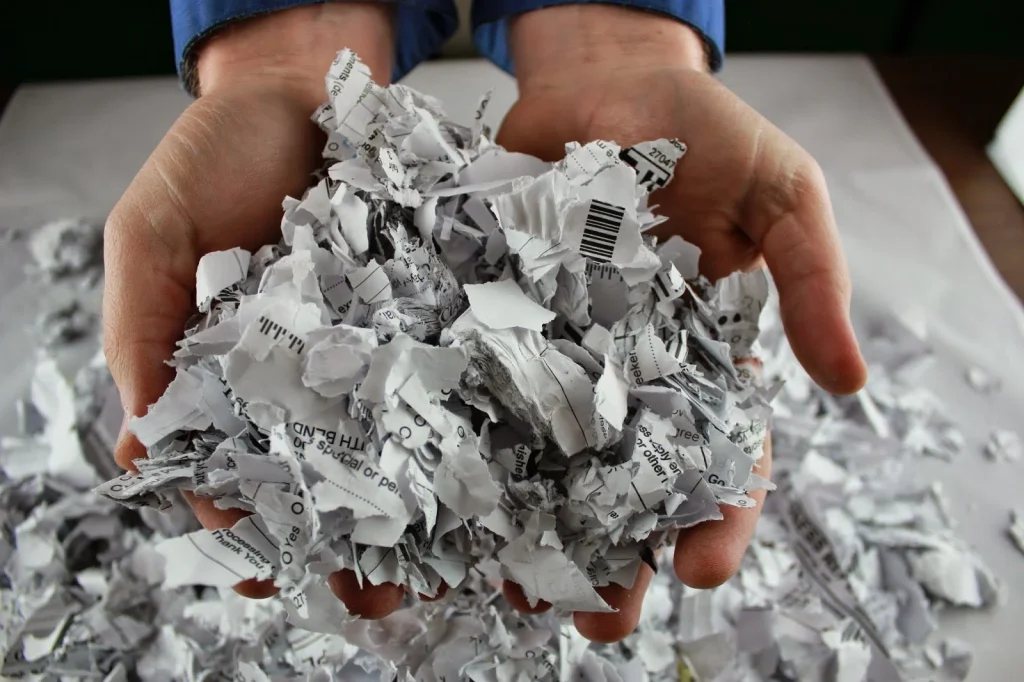 Shredded paper collected from businesses, used in Terra Tag’s papermaking process to create sustainable plantable and recycled name badges