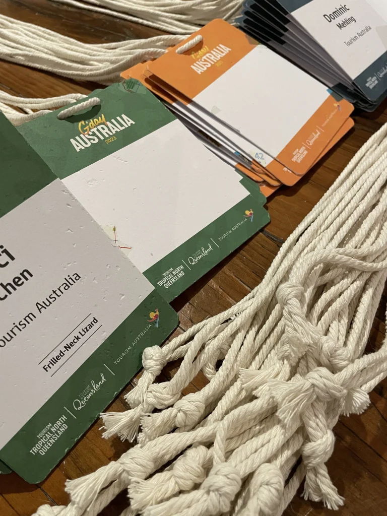 A7 handmade recycled name badges by Terra Tag for a tourism event in Australia, paired with biodegradable lanyards for a sustainable and professional attendee experience