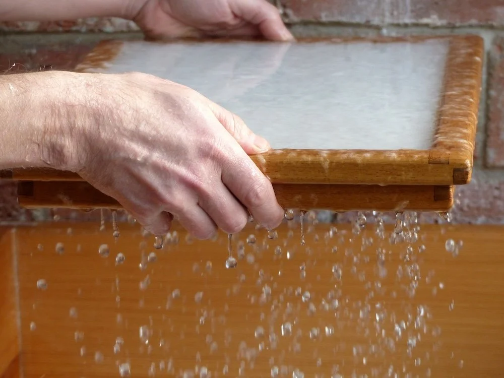 Rhonda Sweet making plantable seed paper by hand, showcasing the sustainable process used to create Terra Tag’s eco-friendly name badges