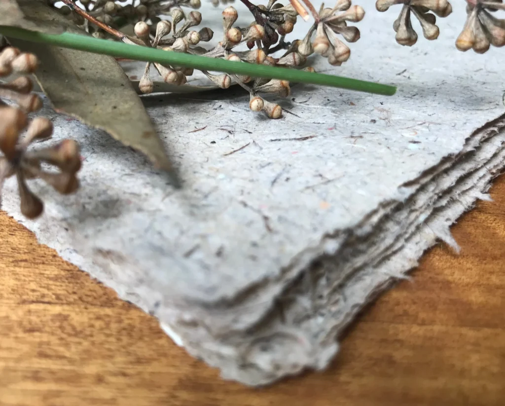 Handmade seed paper by Terra Tag, crafted from recycled materials and embedded with seeds for creating plantable and eco-friendly name badges