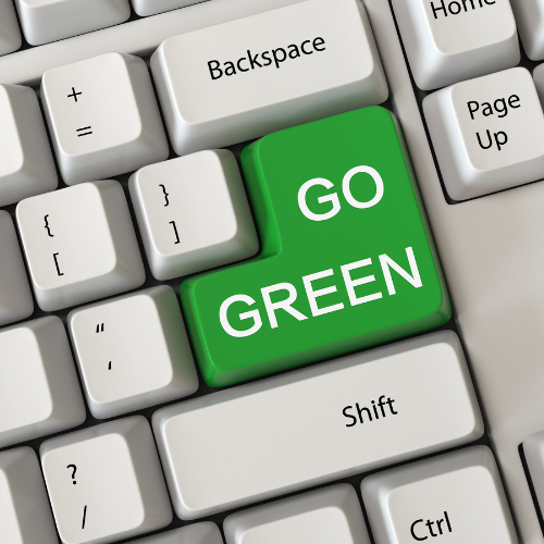 Computer keyboard with a 'Go Green' key, symbolising Terra Tag’s sustainable event solutions including plantable and recycled name badges with biodegradable lanyards