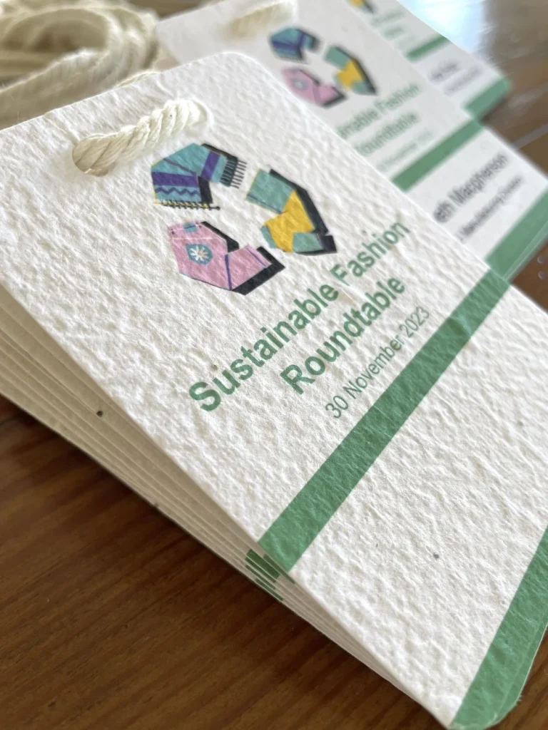 A7 conference name badges by Terra Tag made from plantable seed paper, paired with compostable lanyards for eco-friendly and sustainable events