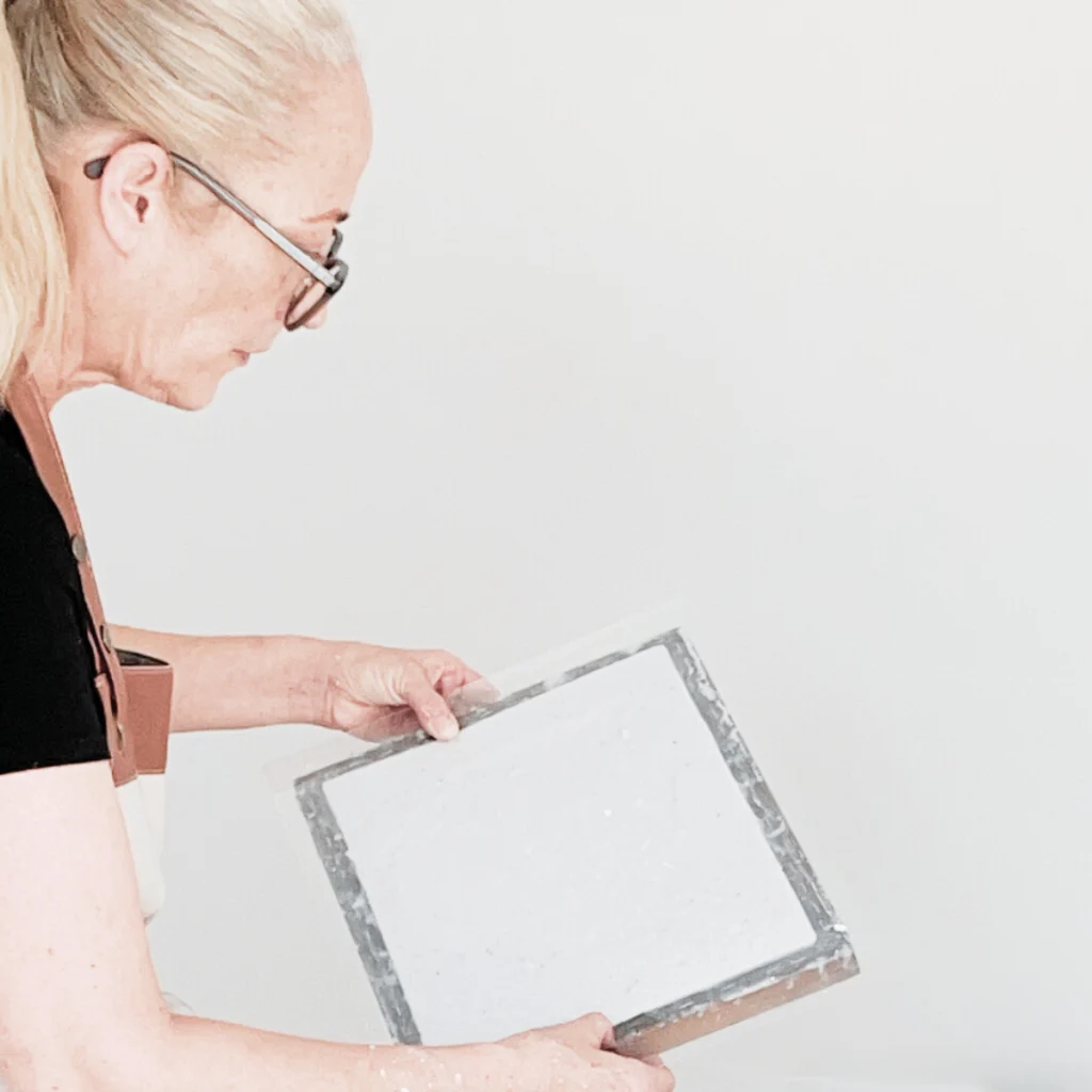 Master papermaker demonstrating how to make plantable seed paper at home