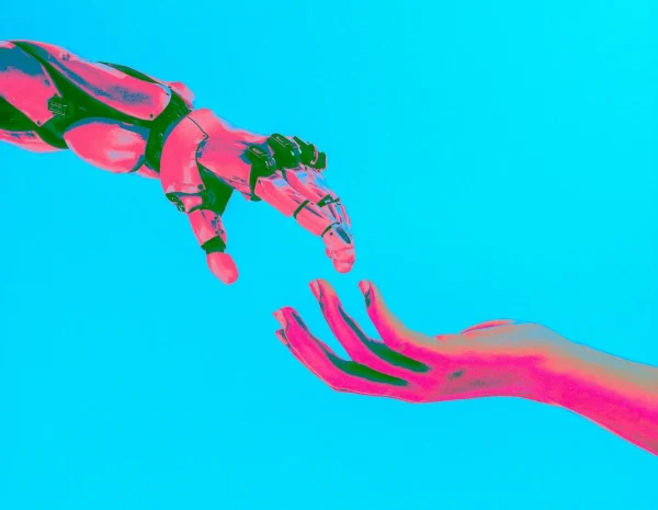 AI in event planning – human and robot hand connecting to symbolise collaboration