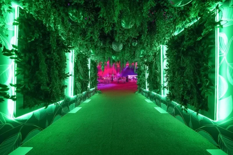 Event entry filled with green plants and eco lighting representing eco-friendly design