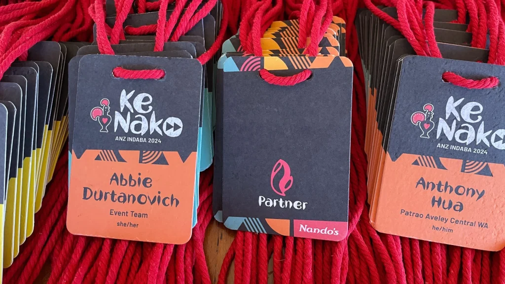 Colourful A7 event name tags by Terra Tag with full-colour printing and biodegradable lanyards, crafted from plantable seed paper for sustainable events
