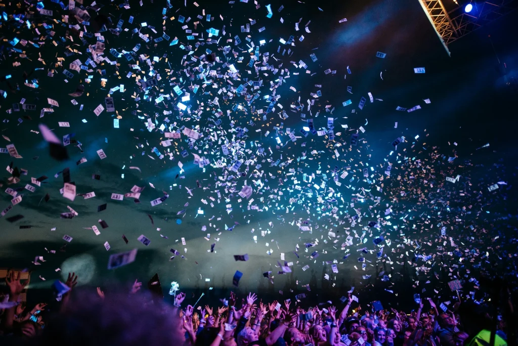Confetti falling over a crowd at an event, highlighting Terra Tag’s plantable and recycled name badges used for vibrant, sustainable celebrations
