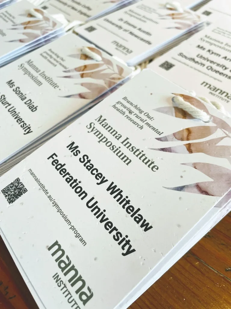 Stunning A6 plantable seed paper name badges by Terra Tag featuring spot colour printing and mixed flower seeds, designed for sustainable and visually striking events