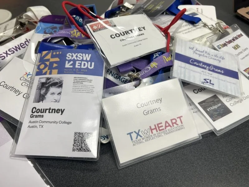 Pile of traditional plastic name badges illustrating the environmental impact and waste, highlighting the benefits of Terra Tag’s sustainable plantable and recycled alternatives