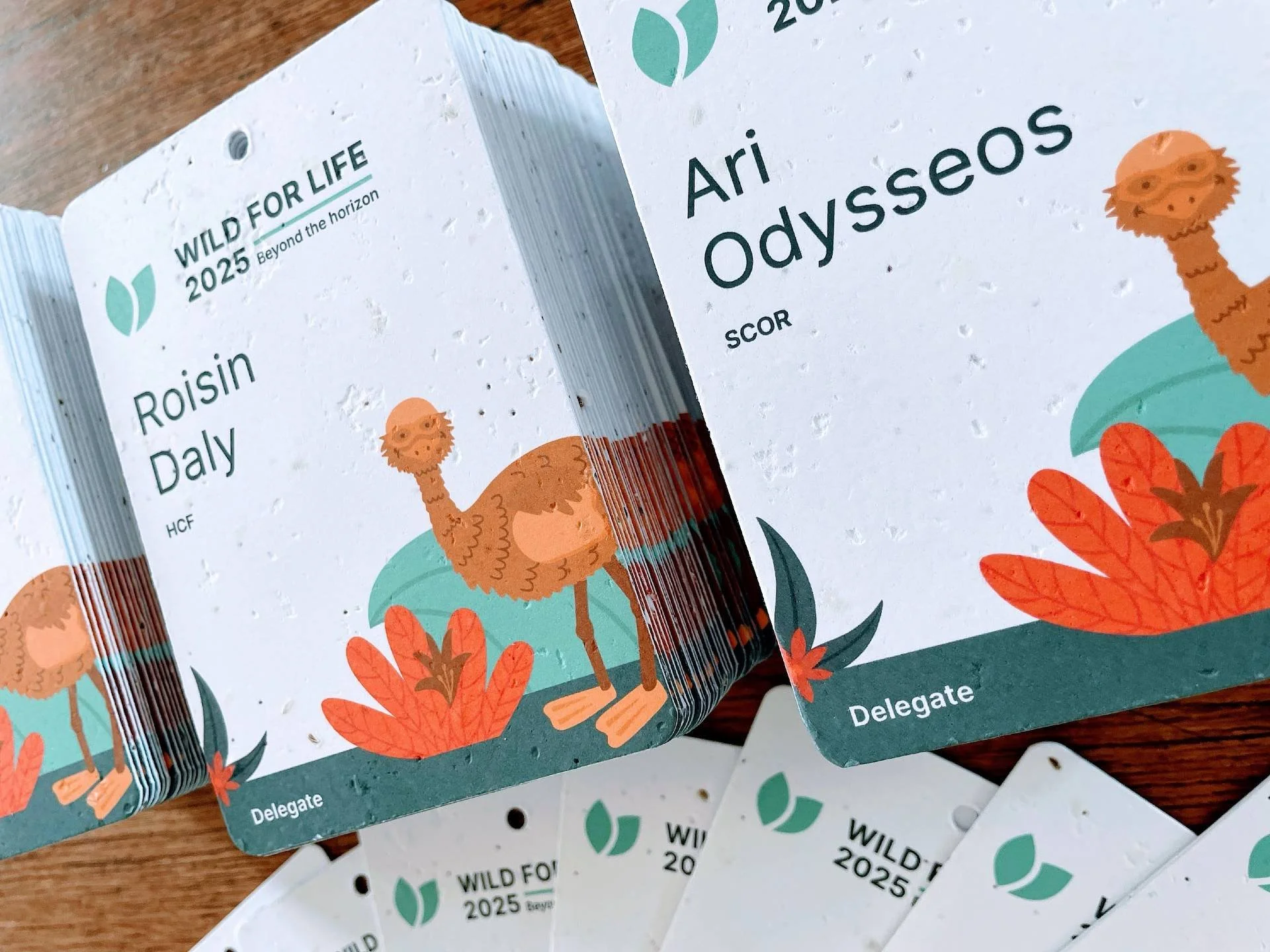 Seed paper name badges with ample white space and clean alignment for conference badge design