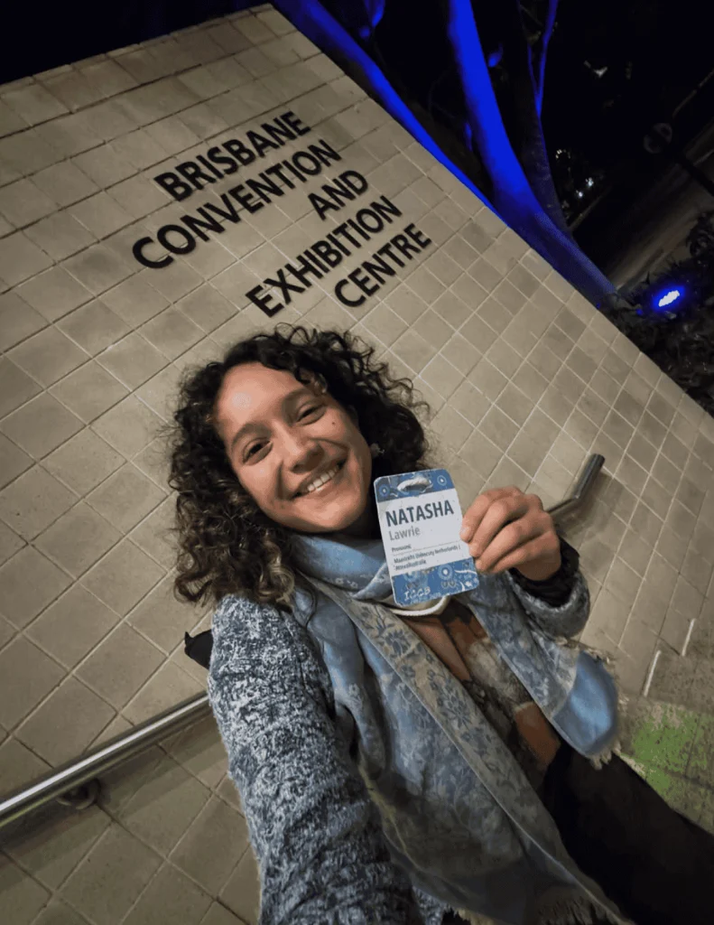 Conference guest wearing a Terra Tag seed paper name badge with biodegradable lanyard