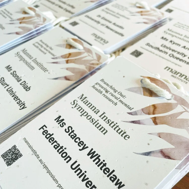 Eco-friendly A6 conference name badges crafted from Australian native flower seed paper.