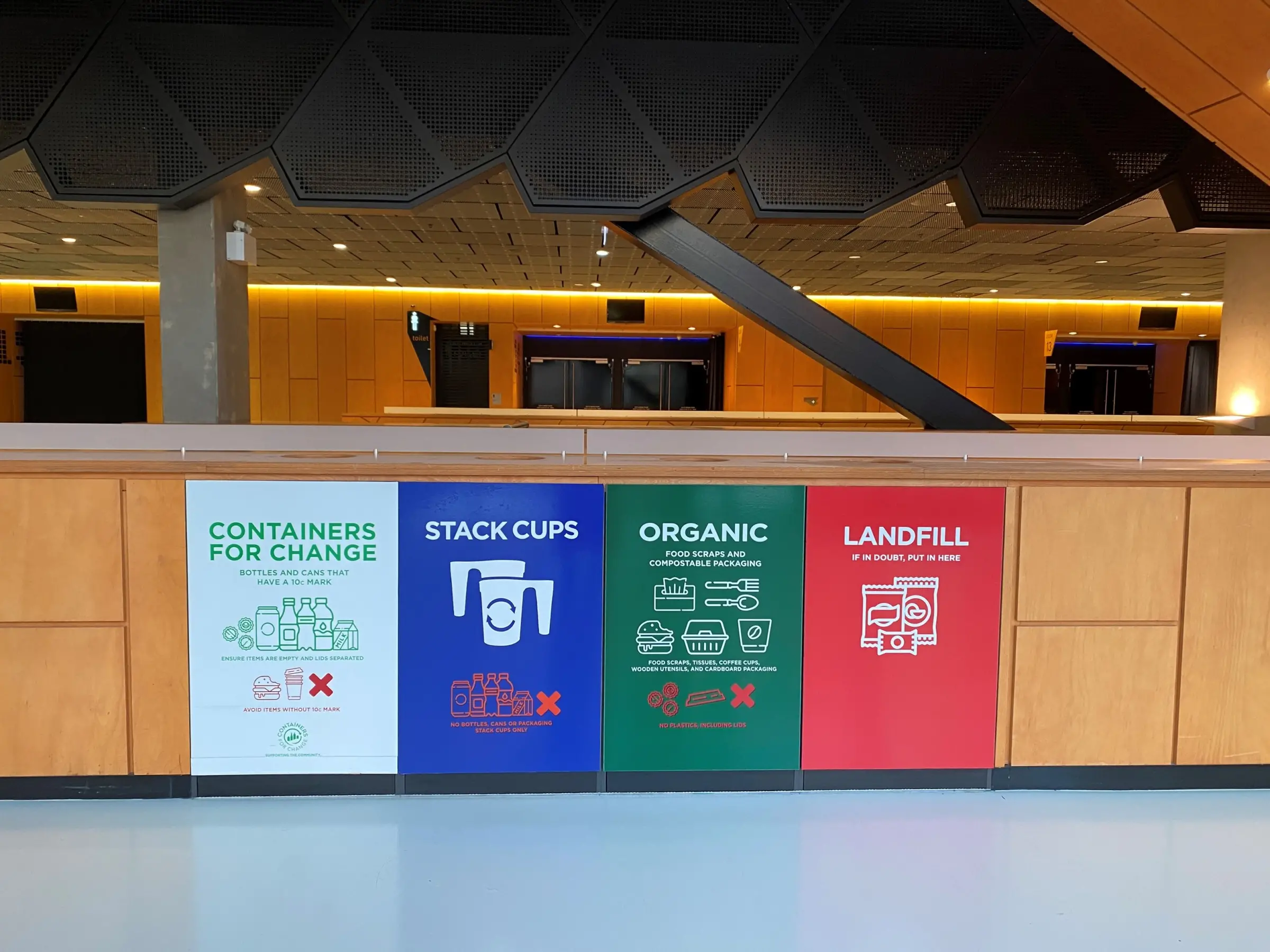 conference waste station showing biodegradable name tags and paper lanyards