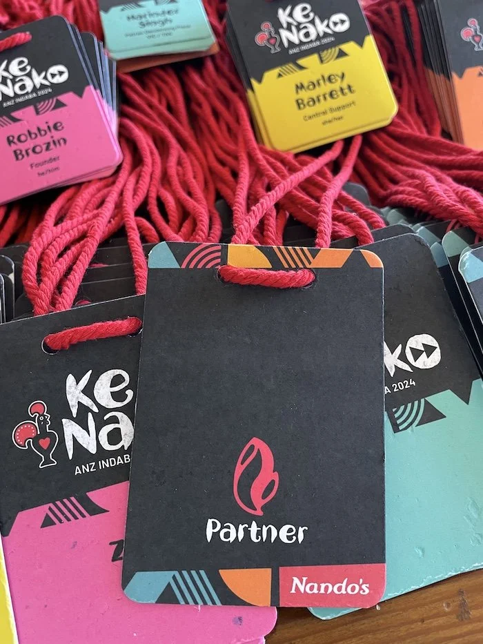 Conference name badges on recycled paper for a national Nando's team event