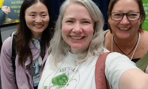 Conference guests wearing plantable paper name badges