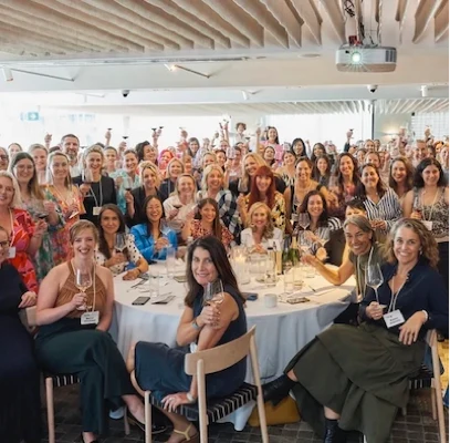 Guests at a corporate event wearing eco friendly seed paper name badges, assembled with biodegradable cotton lanyards.