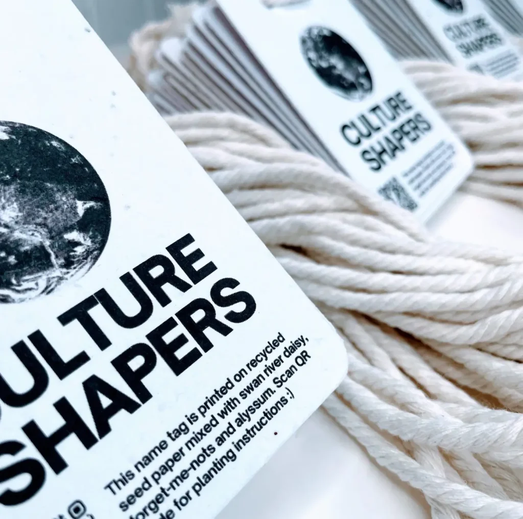 Stylish seed paper name badge for the Culture Shapers event, featuring sustainable plantable stock.