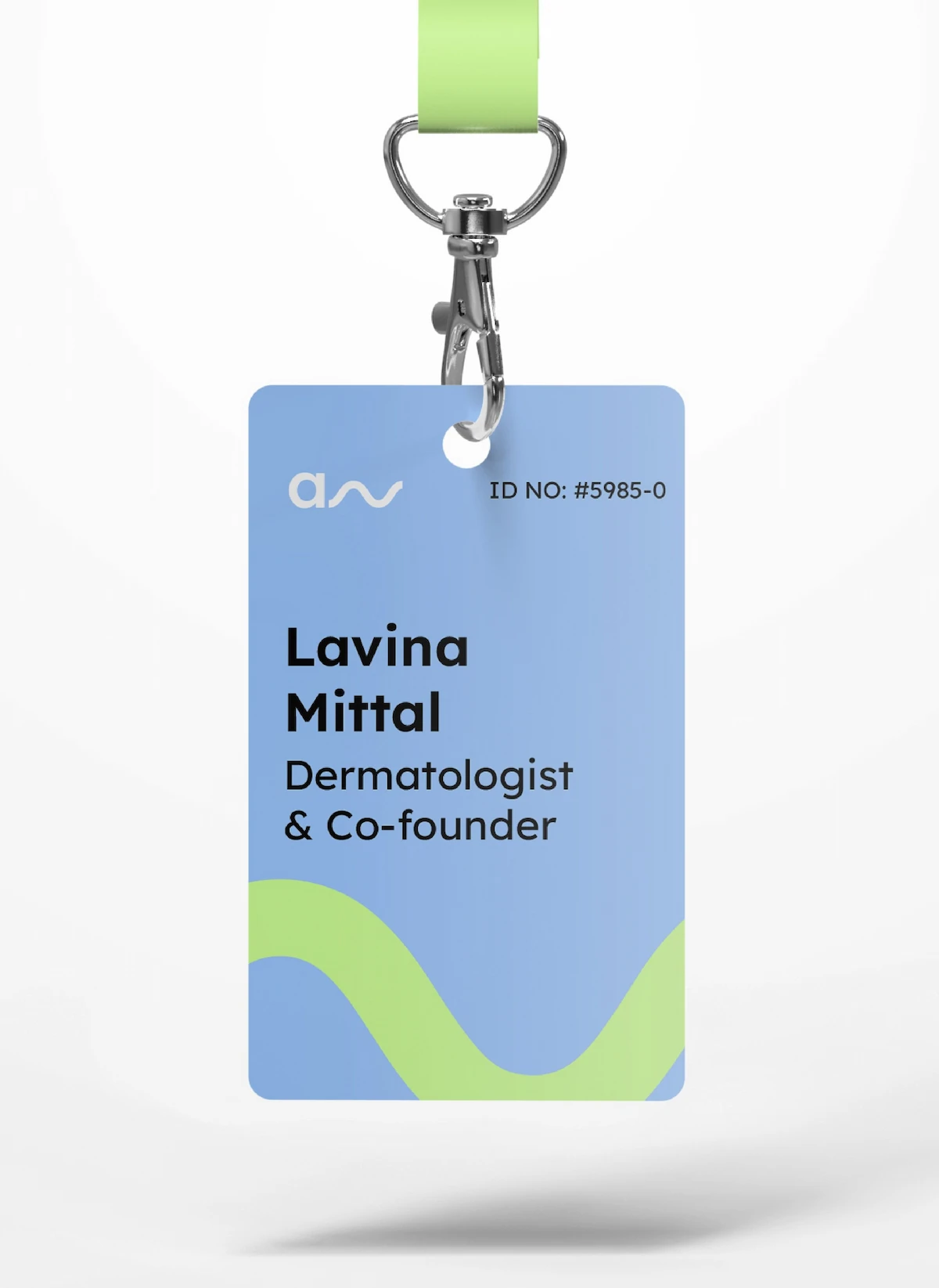 Blue left-aligned conference name badge on a lanyard, with a large bold name above the job title